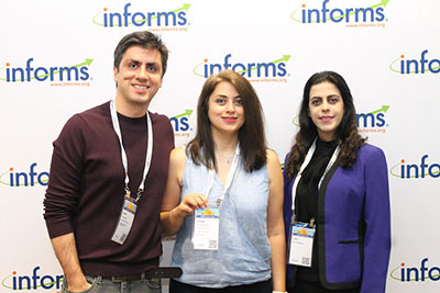 2021_attendees_posing_in_front_of_INFORMS_backdrop