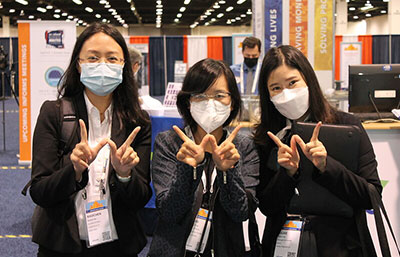 three-female-students-in-the-exhibit-hall